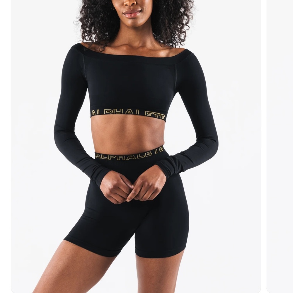 Alphalete Black Off-Shoulder Long Sleeve Crop Top with Gold Logo Band